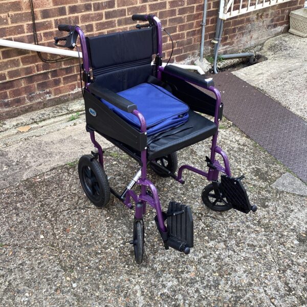 Purple Days folding wheelchair, a portable mobility aid.