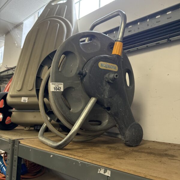 Used Hozelock hose reel for garden hose storage.
