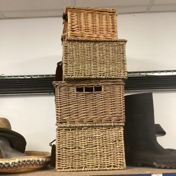 Stacked vintage wicker baskets for rustic home storage.