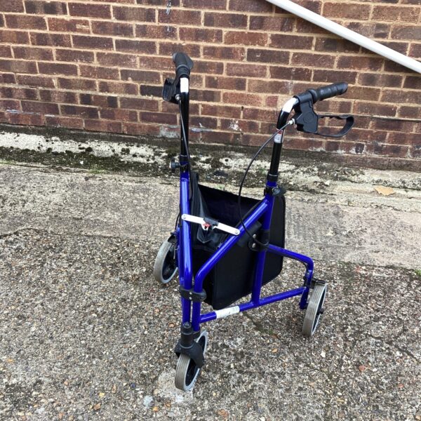 Blue Drive three-wheeled walking aid with wire basket.