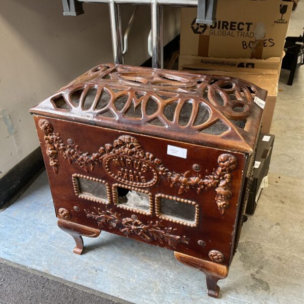 Antique Mirus Paris cast iron burner with enamel detailing.