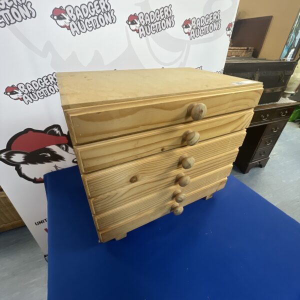 Small pine collectors chest with multiple drawers.