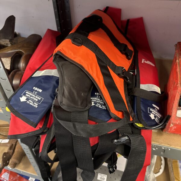Used nylon life jacket for marine safety and boating.