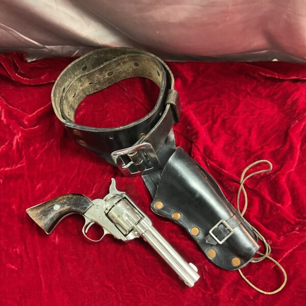 Vintage western gun belt and 44-40 caliber pistol set for collectors.