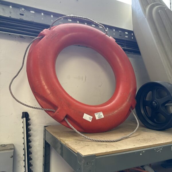 Orange Besto life ring buoy for marine safety.