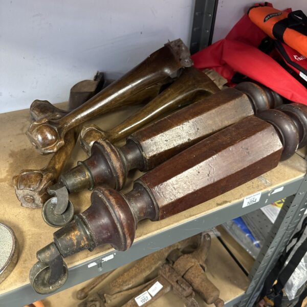 Antique chair and piano legs with claw and ball feet.