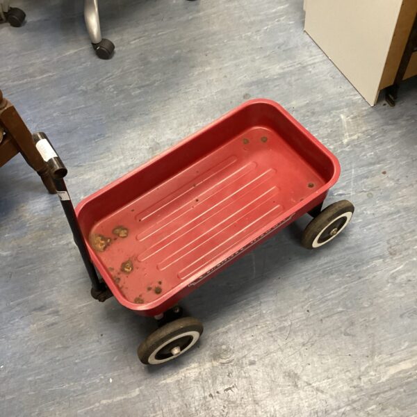 Classic red wagon, vintage toy for children and garden use.