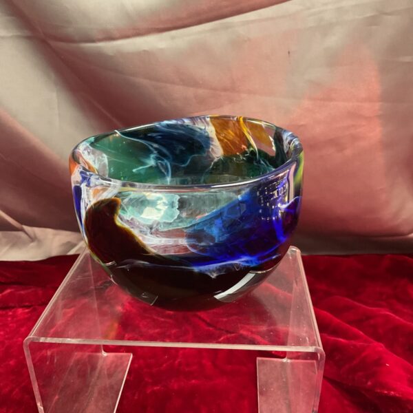 Iridescent Shakespeare Glass bowl on a stand.