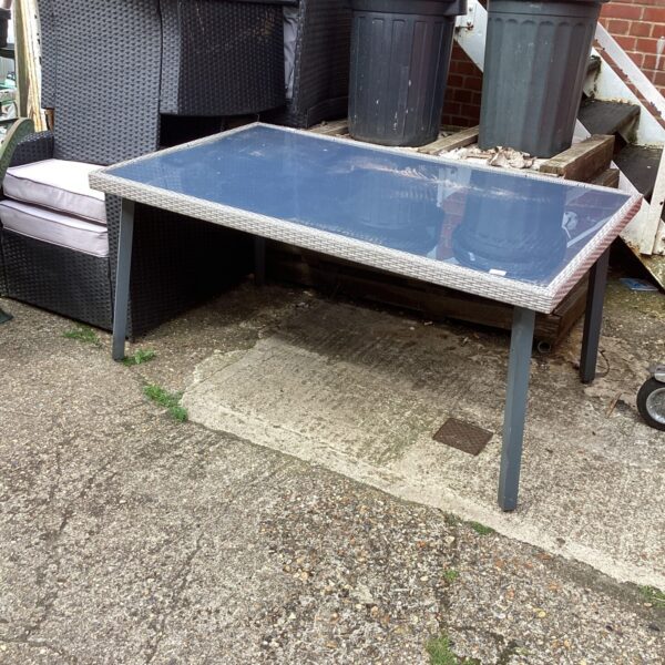 Large garden glass table with metal frame, suitable for outdoor use.