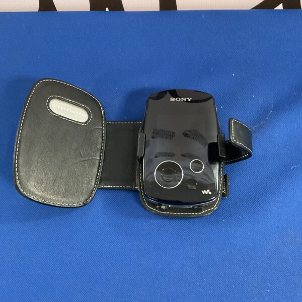 Vintage Sony MP3 player with protective case, side view.