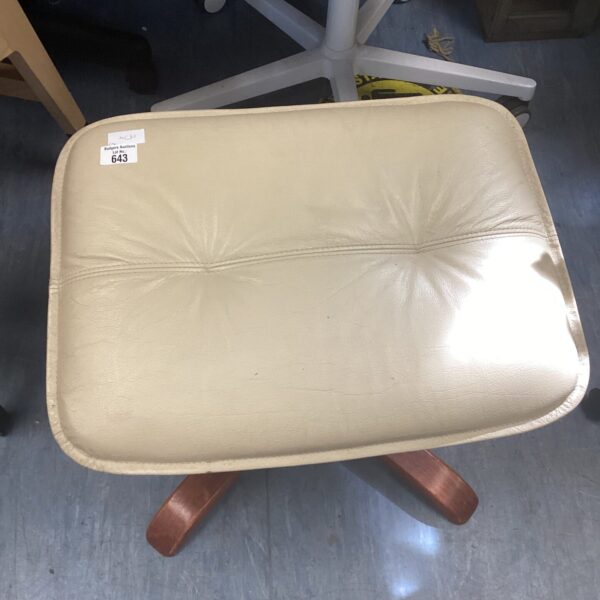 Vintage leather foot stool with curved wooden legs.