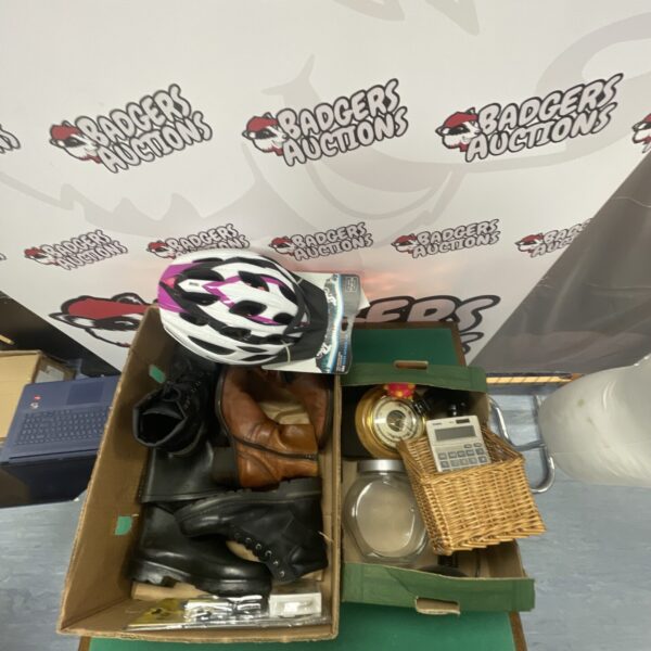 Mixed lot of boots, helmet and wellies for outdoor activities.