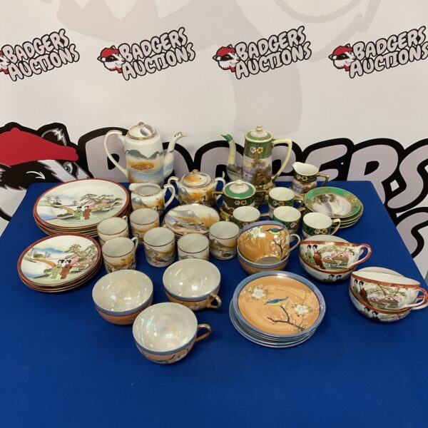 Vintage Noritake hand-painted tea set with floral designs.