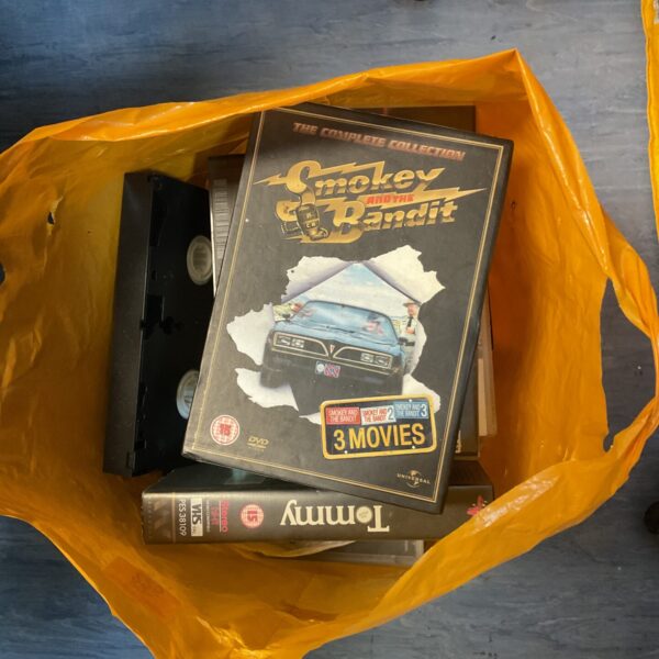 Vintage VHS and DVD collection of Smokey and the Bandit movie.