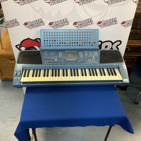 Vintage Orla KX10 electronic keyboard for sale.