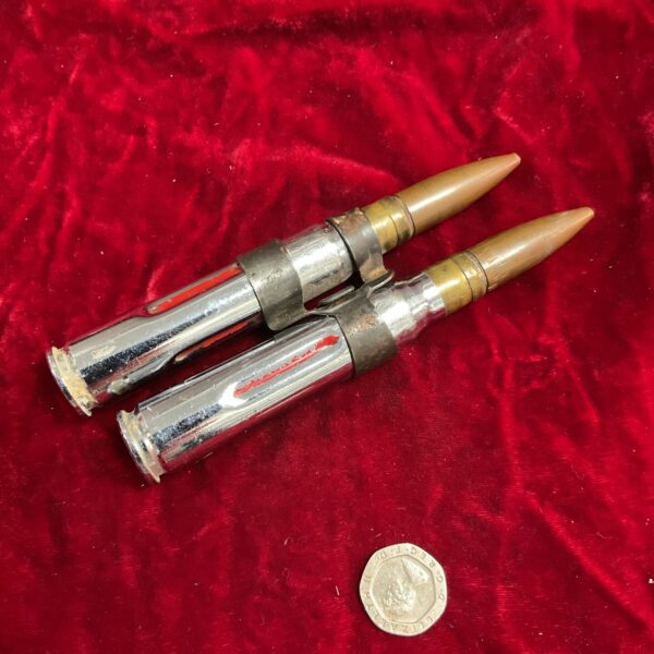 Linked 50 caliber practice rounds for collectors and display.