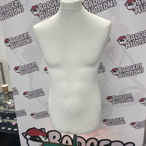 Vintage male mannequin torso for clothing display.