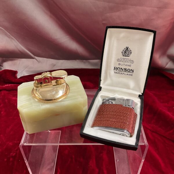 Vintage Ronson Varaflame onyx butane lighter with gold accents.