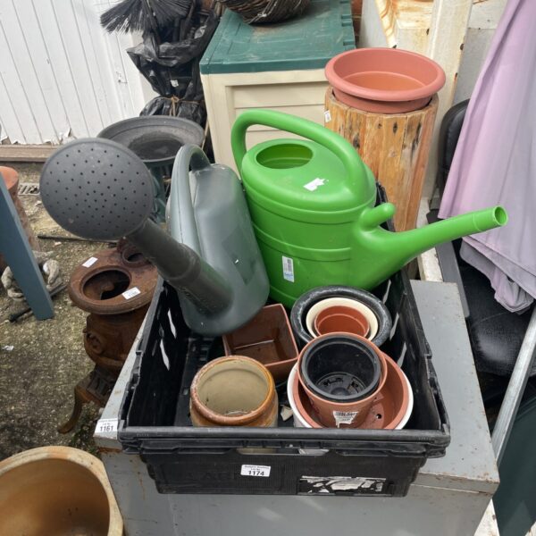 Garden bundle with terracotta and plastic plant pots and watering cans.
