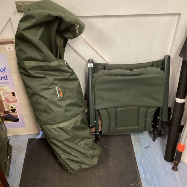 Fishing bivvy and folding chair set for outdoor angling.
