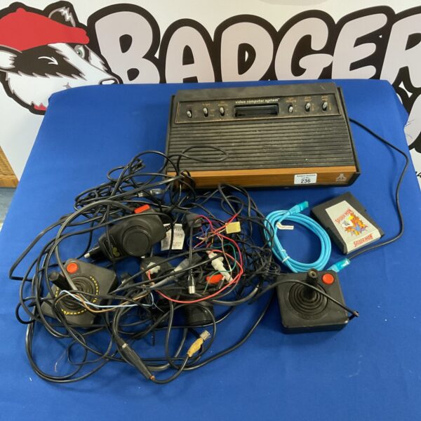 Vintage Atari Video Computer System console with woodgrain finish.