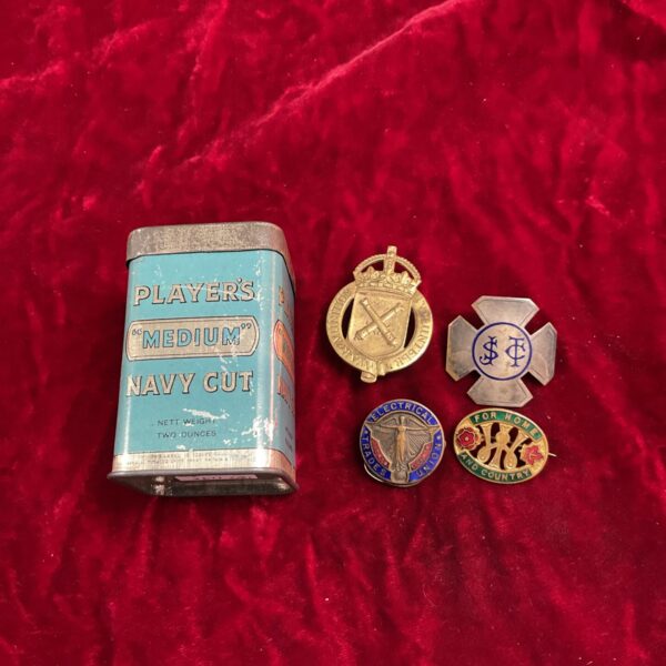 Vintage Player Navy Cut tobacco tin with four military badges.