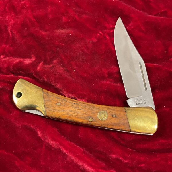 Vintage Fox lock knife with brass and wood handle.