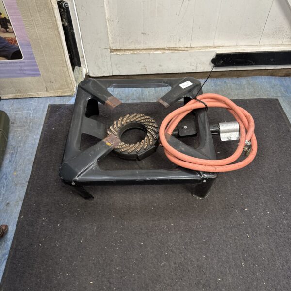 Large camping gas ring with hose for outdoor cooking.
