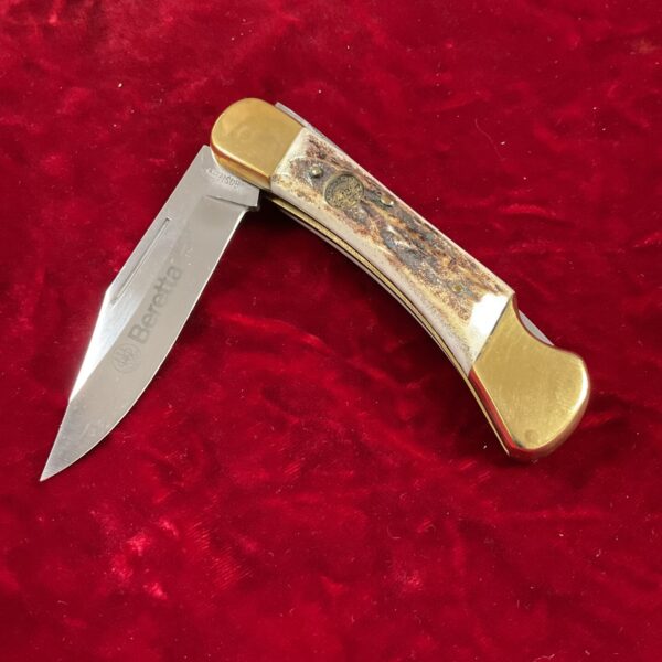 Vintage Beretta pocket knife with bone handle and lockback blade.