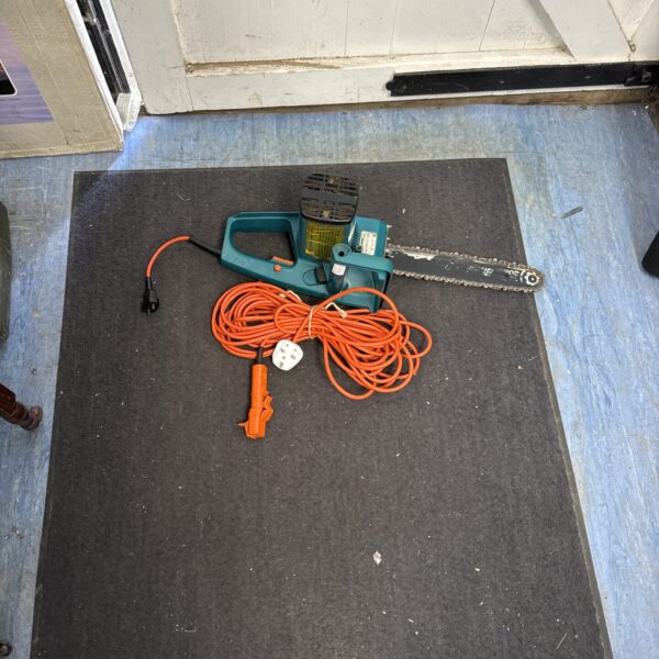 Black & Decker electric chainsaw with extension cable for garden use.