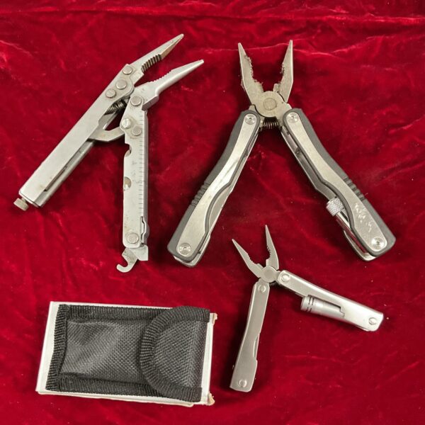 Stainless steel multi tool with pliers and knife blade.