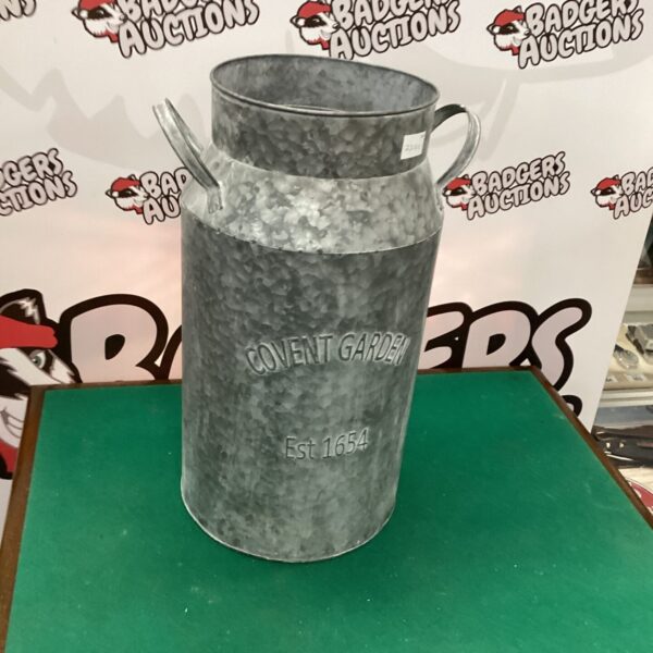 Vintage galvanised milk churn, a classic dairy farm container.