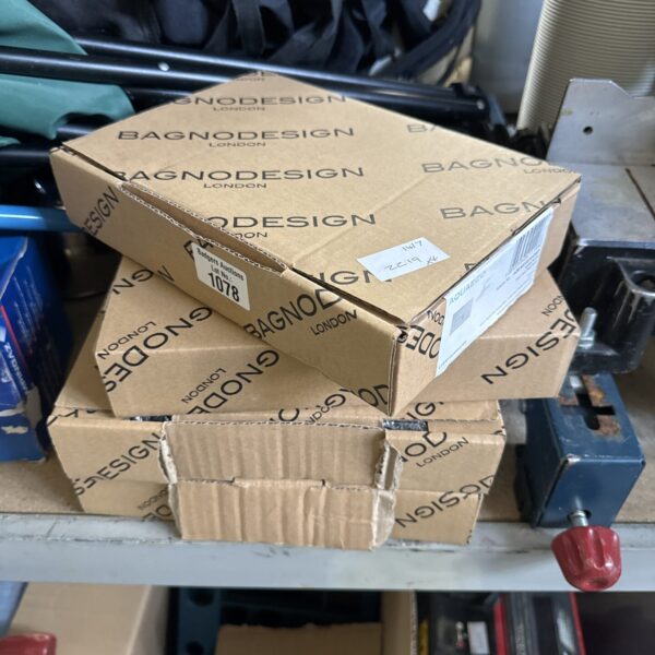 Stack of four BagnoDesign Aquaeco dual flush plates in packaging.