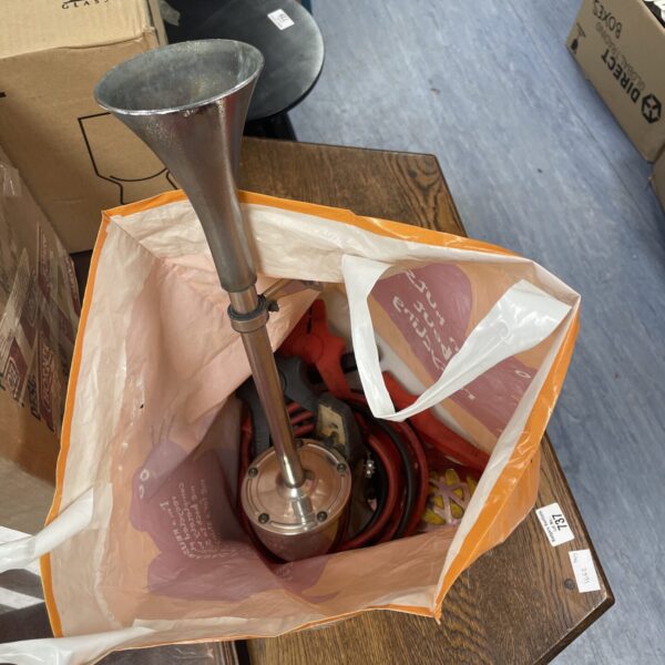 Metal air horn for vehicle signaling, a collectible item.