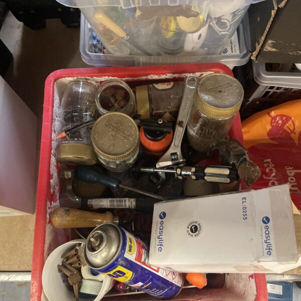 Mixed tool and hardware lot with WD40 and nails.