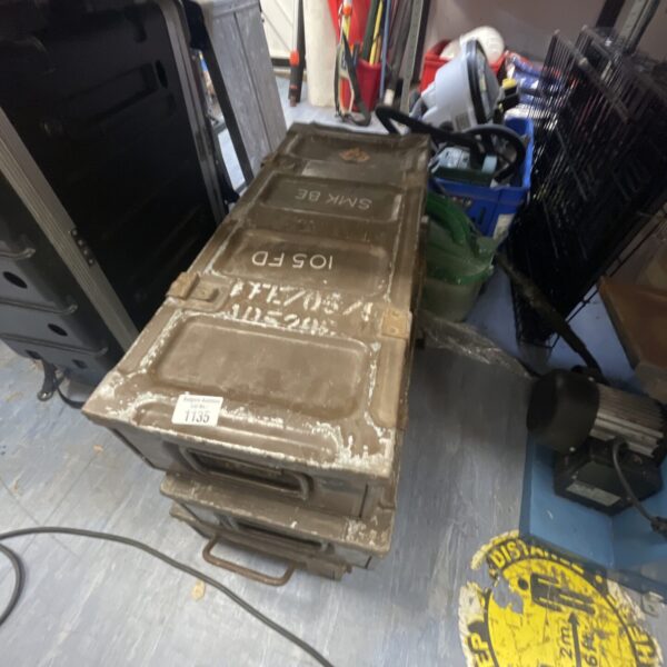 Vintage metal ammunition crate marked “50 Cal” and “SMK”.