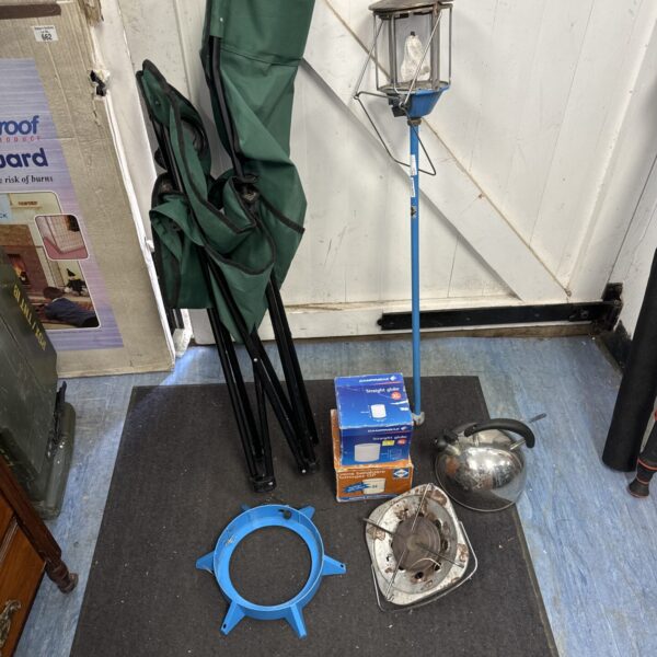 Assorted camping equipment lot including lantern and tent poles.