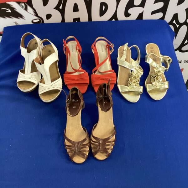 Ladies size 5 shoe lot with assorted sandals and heels.