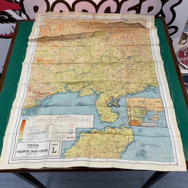 Vintage WWII French Indochina escape map, Sheet L, displayed on a table.