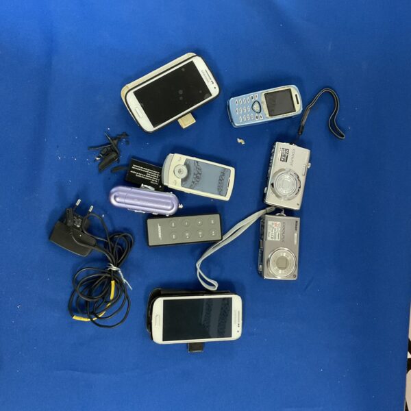 Vintage collection of Samsung phones and digital cameras for collectors.