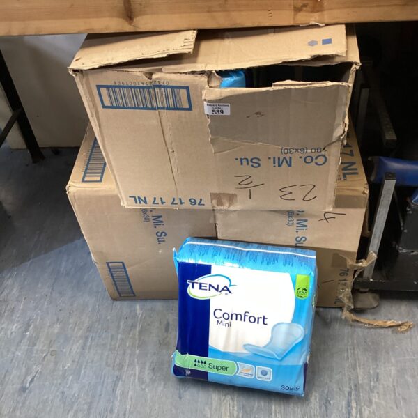 Three boxes of unopened Tena Comfort Mini Super pads for incontinence.