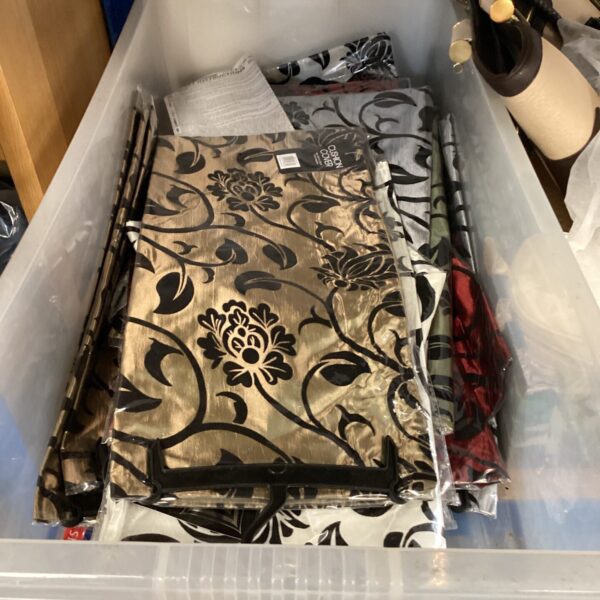New patterned cushion covers in a storage box.