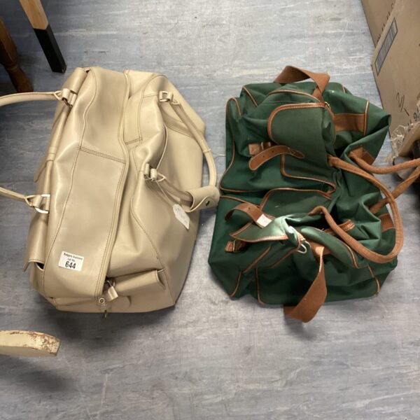 Pair of vintage canvas holdall bags, showing wear and tear.