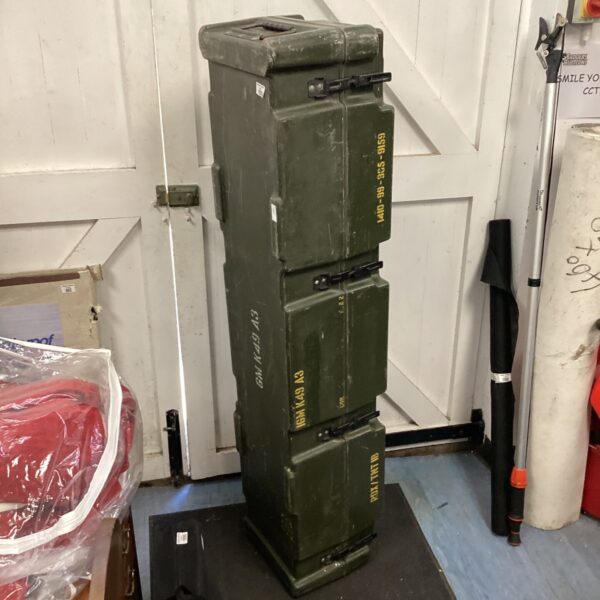 Vintage military bazooka case, model M19, showing signs of wear.