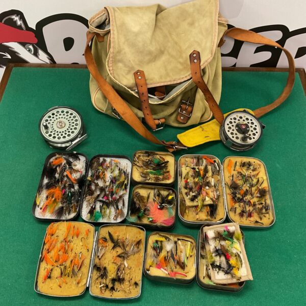 Vintage fly fishing tackle lot with reels and fly tins.