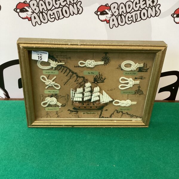 Vintage framed display of nautical sailing knots for maritime decor.