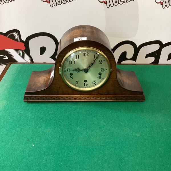 Vintage 1920s Napoleon mantle clock with striking mechanism.