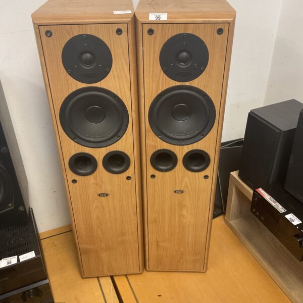 Vintage Eltax speakers with woodgrain finish, ideal for retro audio.