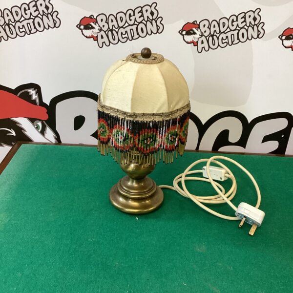 Vintage Art Deco brass gypsy lamp with fringed shade.