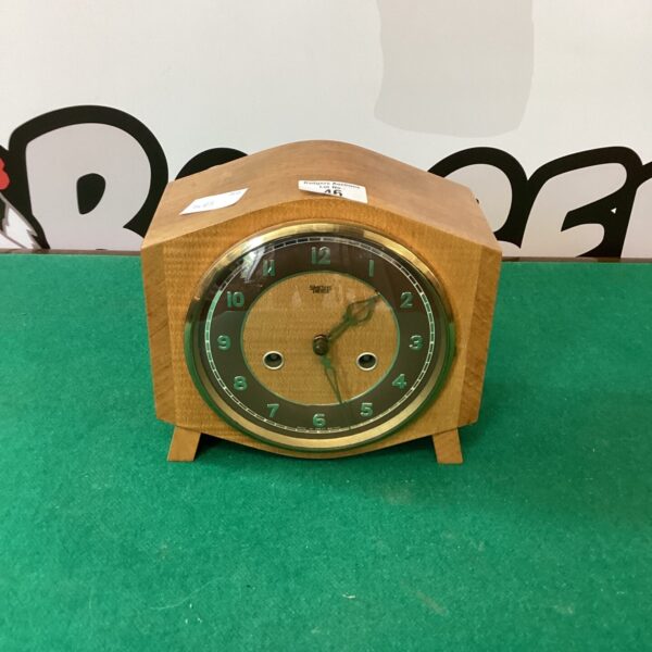 Vintage Smiths oak mantle clock with striking mechanism.